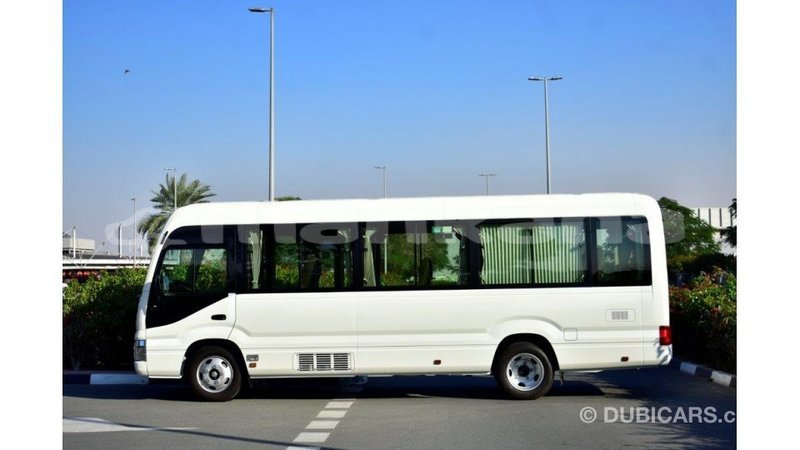Big with watermark toyota coaster abhasia import dubai 2005