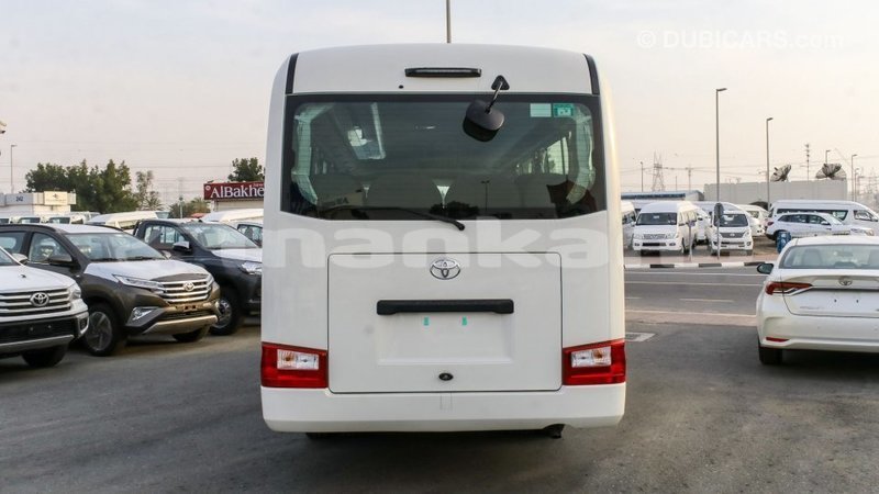 Big with watermark toyota coaster abhasia import dubai 2196